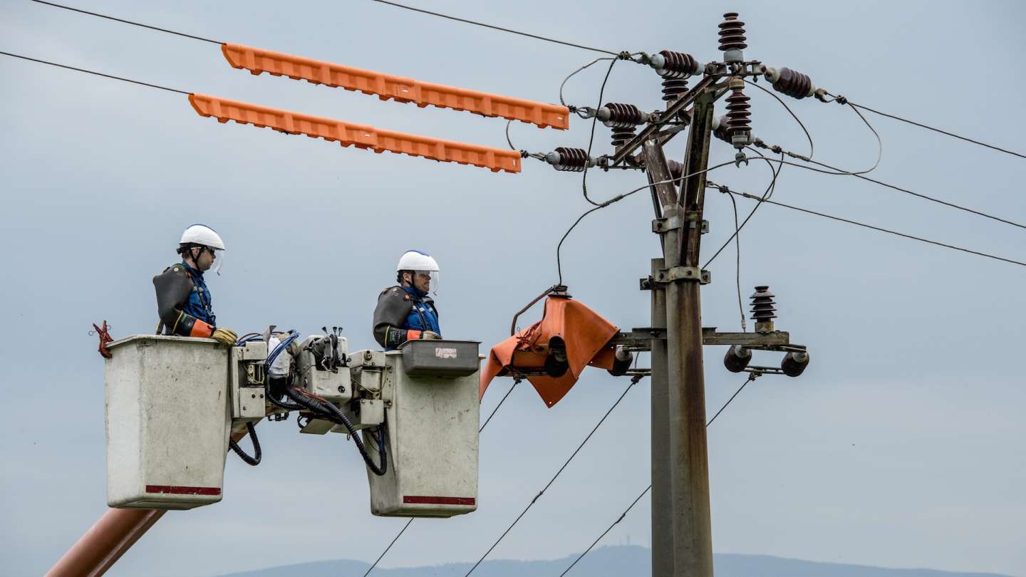 Instalation of insulators on electric power lines in eastern part of Slovakia